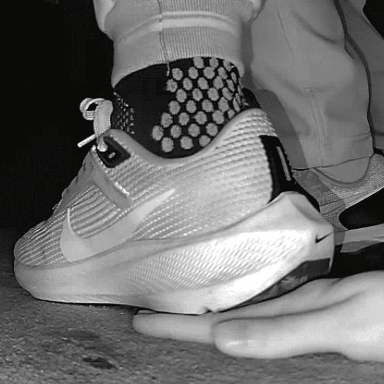 Cinema young girl candid hand trample with Nike running shoes