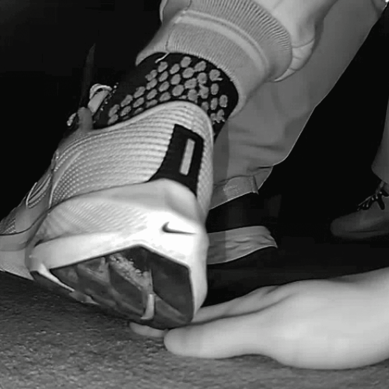 Cinema young girl candid hand trample with Nike running shoes