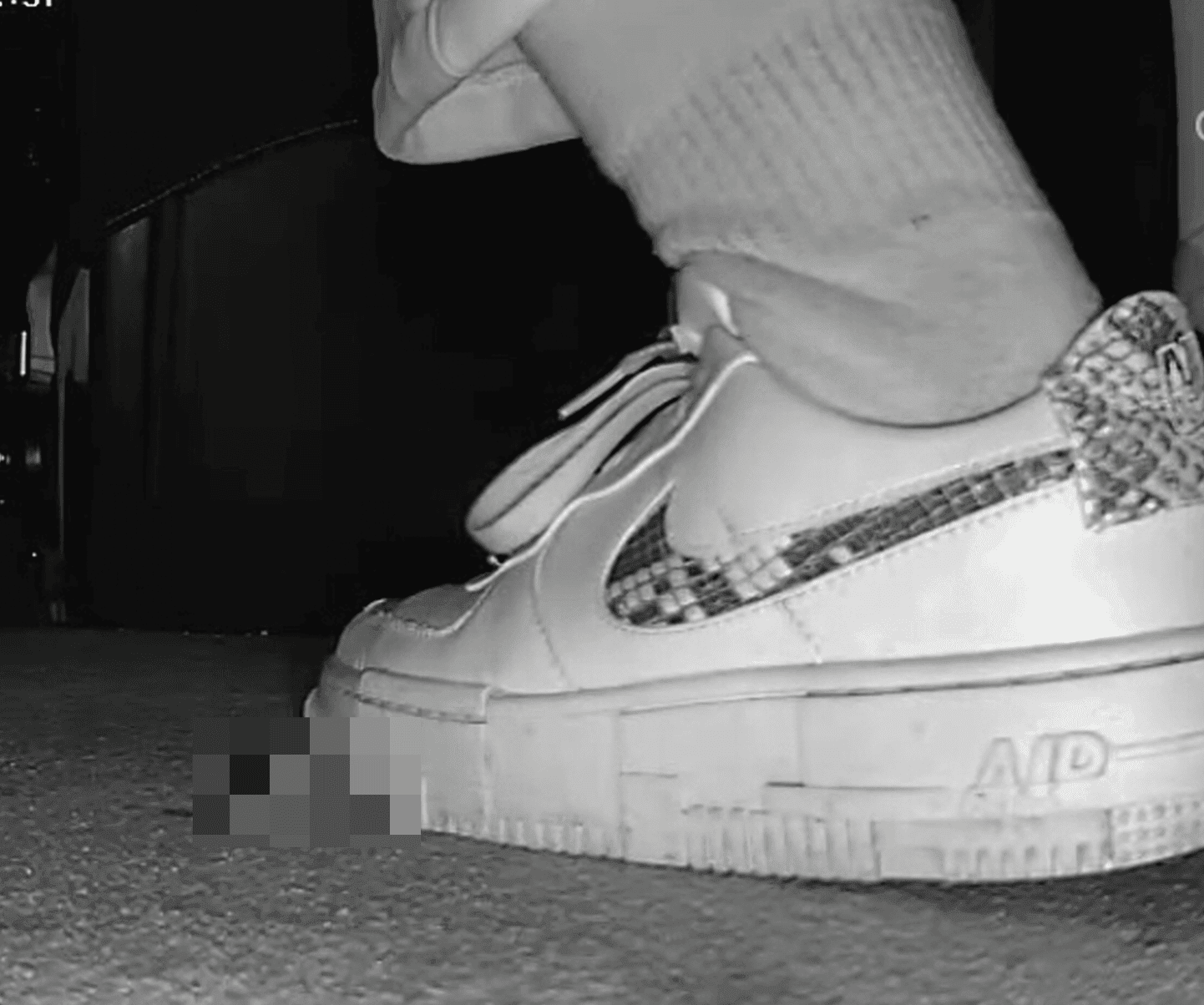 Girl in a cinema candid crush with Nike sneaker
