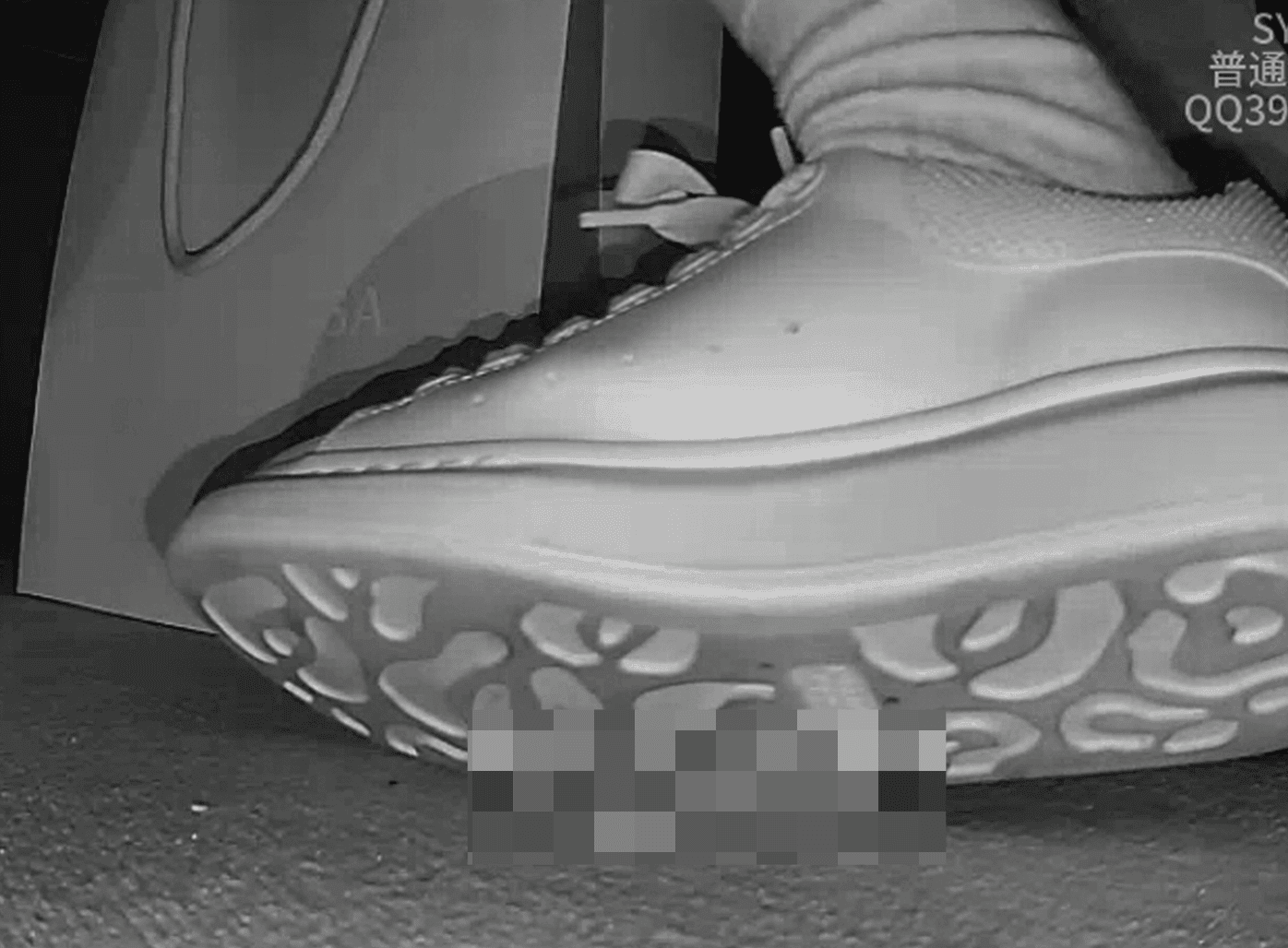 Woman candid crush with white socks and McQueen sneakers in cinema