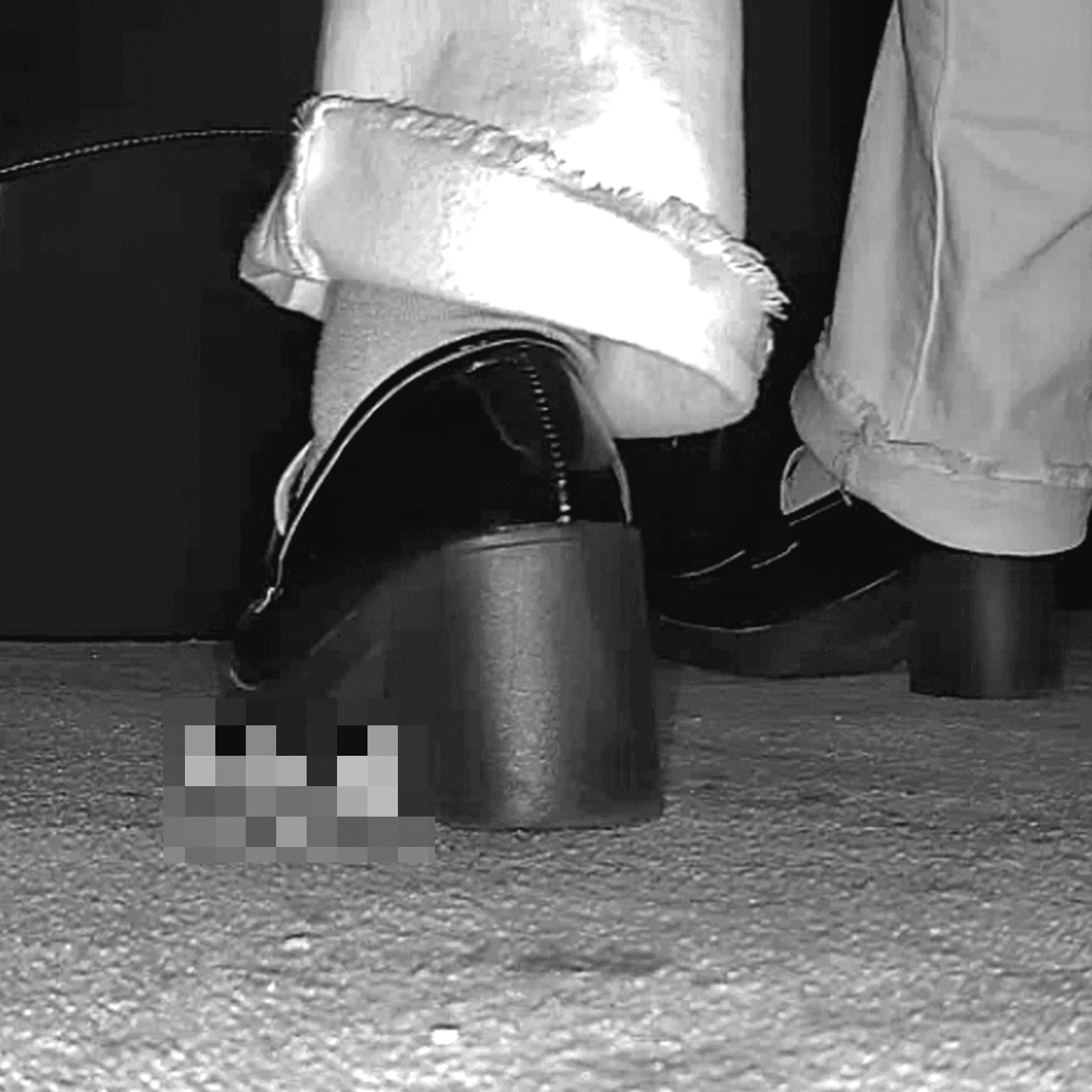 Woman with black chunky heeled shoes candid crush in movie theater