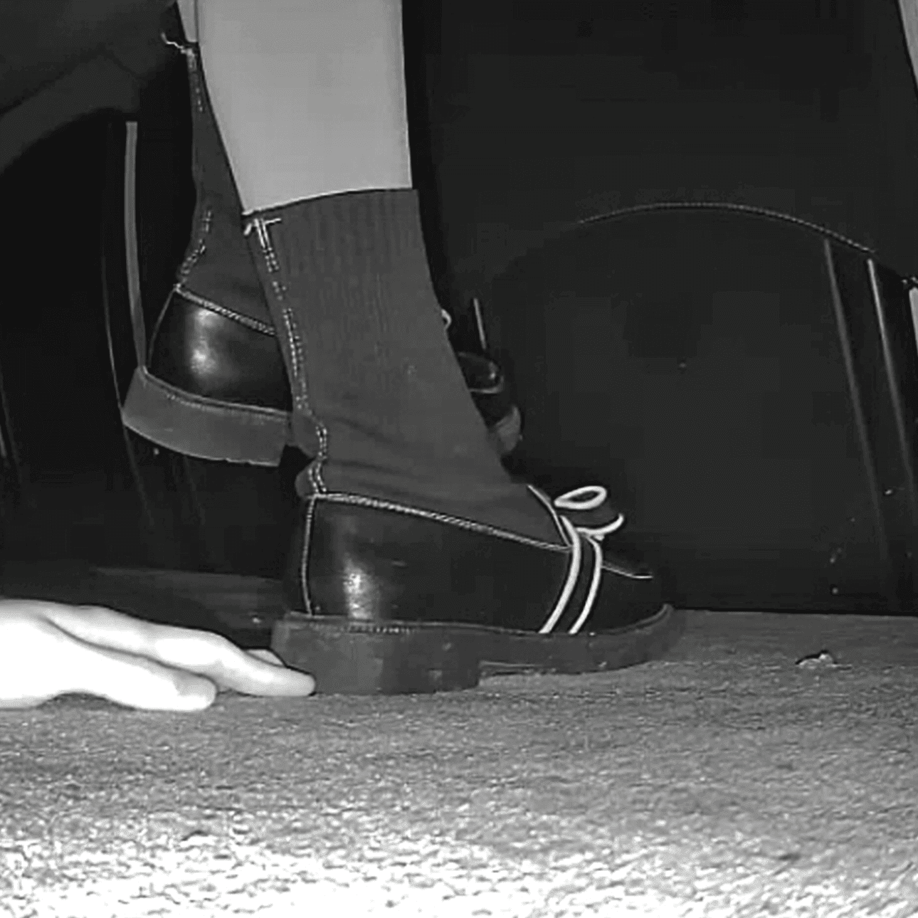 Cinema cute girl candid stepping on hand with black leather shoe heels