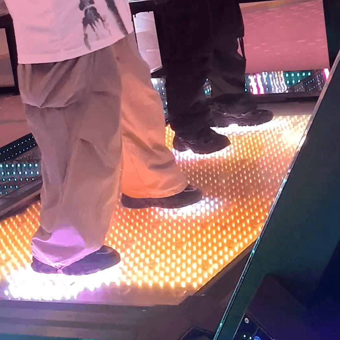 Two ladies in black sneakers candid crush on the dance machine