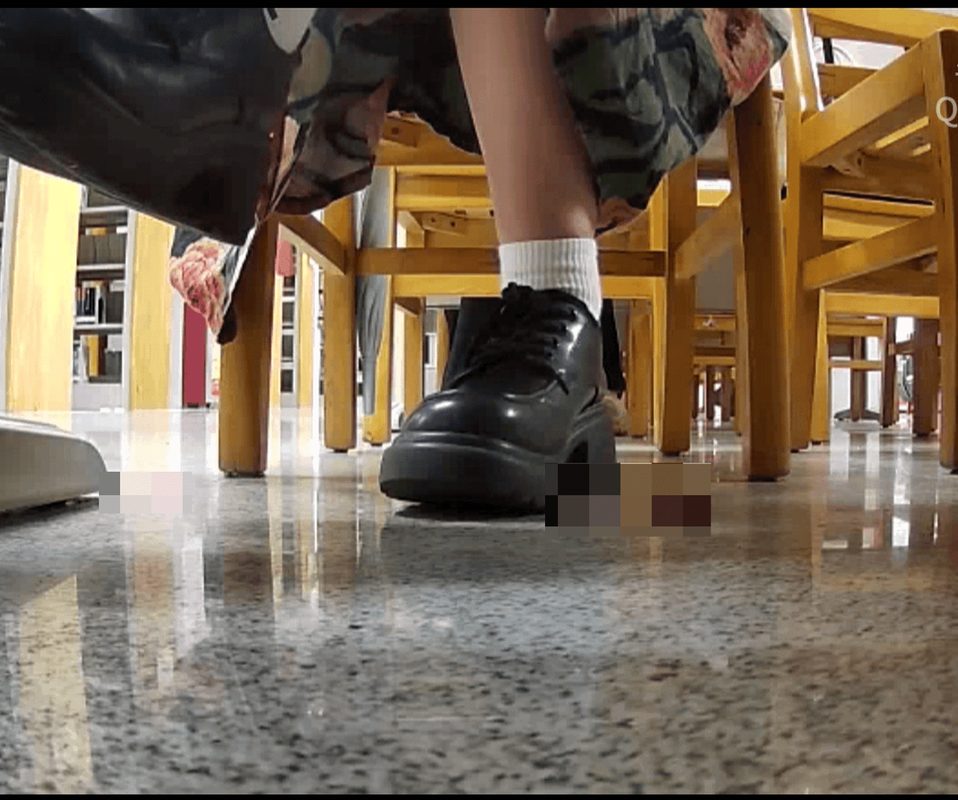 Woman in chunky heels candid crush under the library table