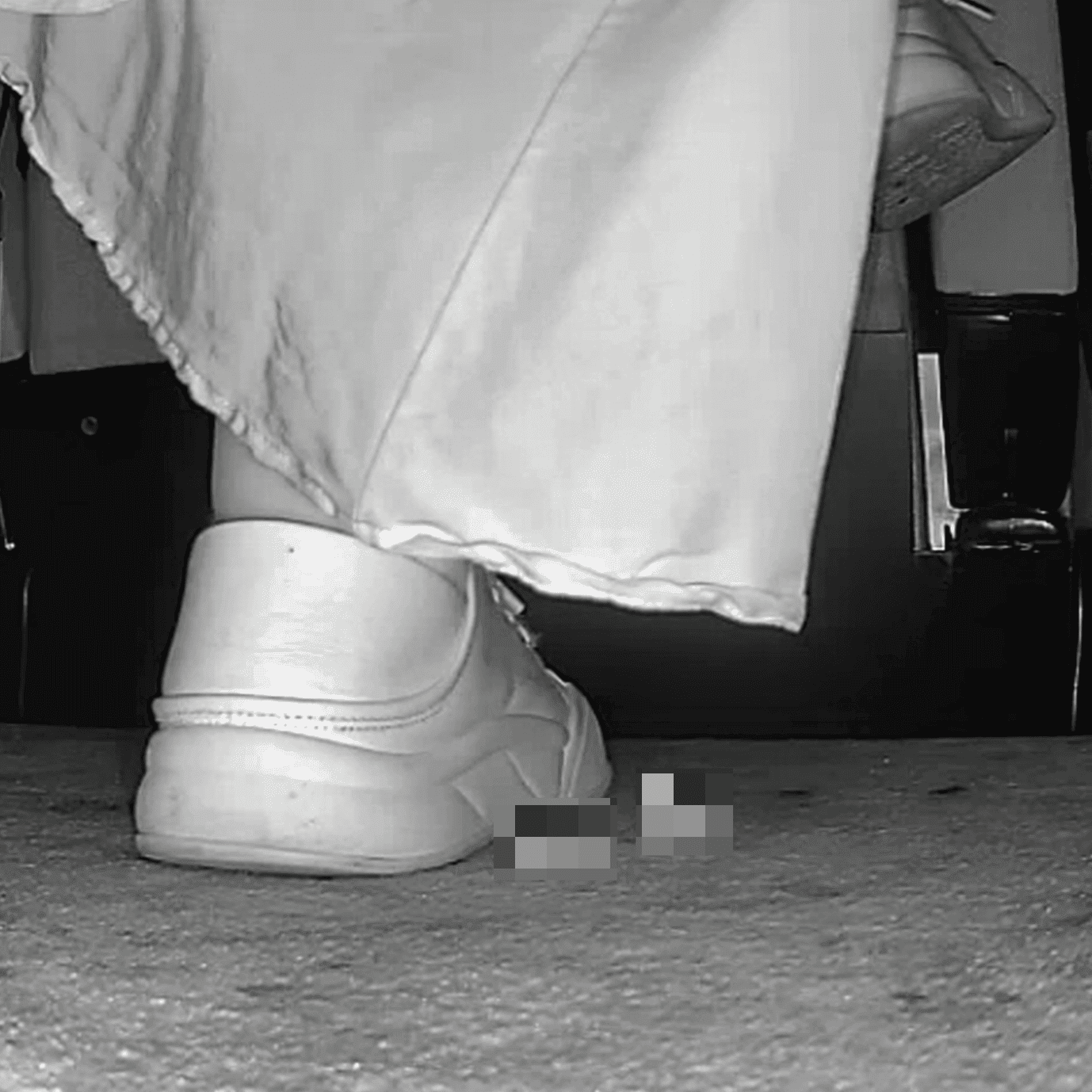 Woman in skirt and white sneakers candid crush in the cinema