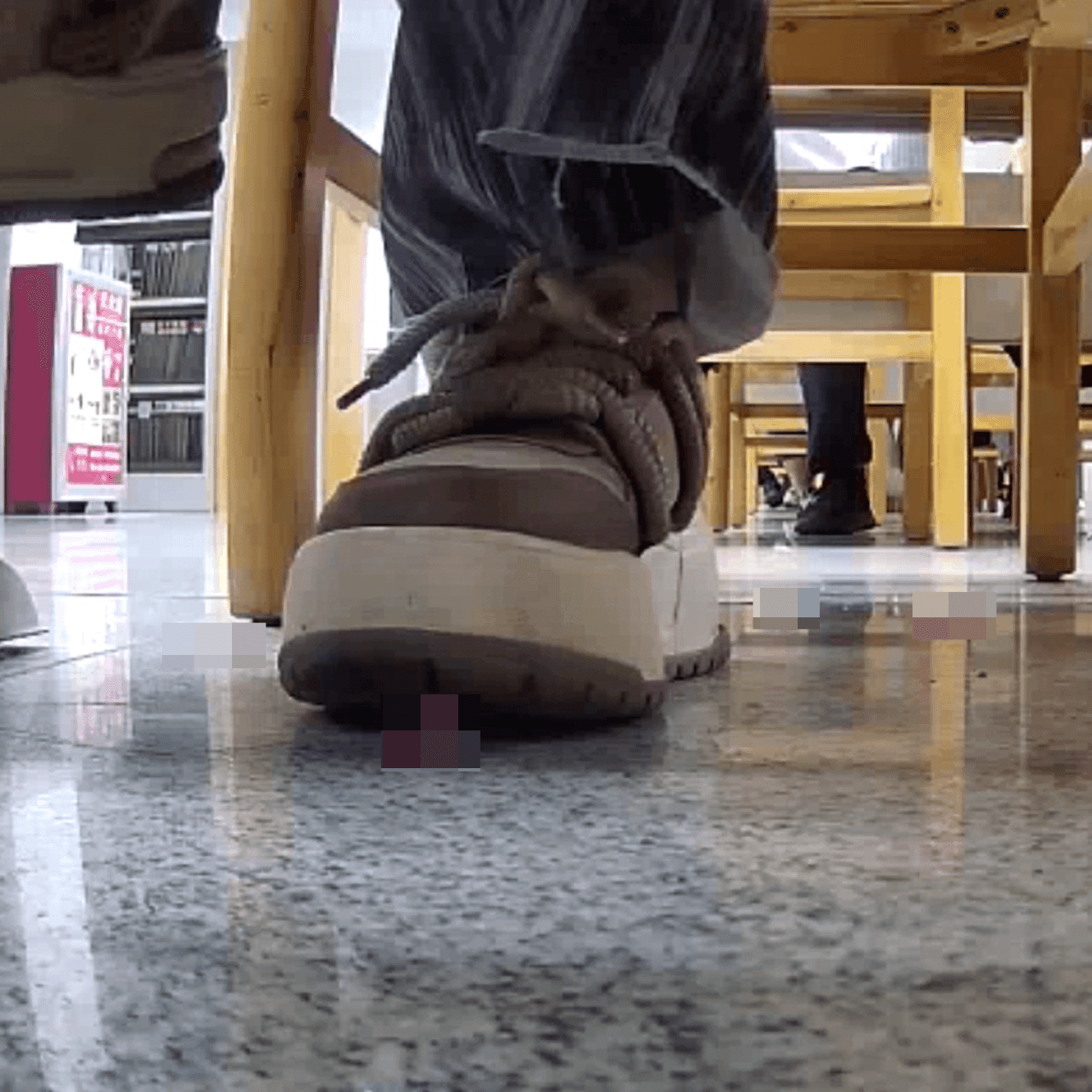 Woman at the library candid crush with the toe of her sneaker