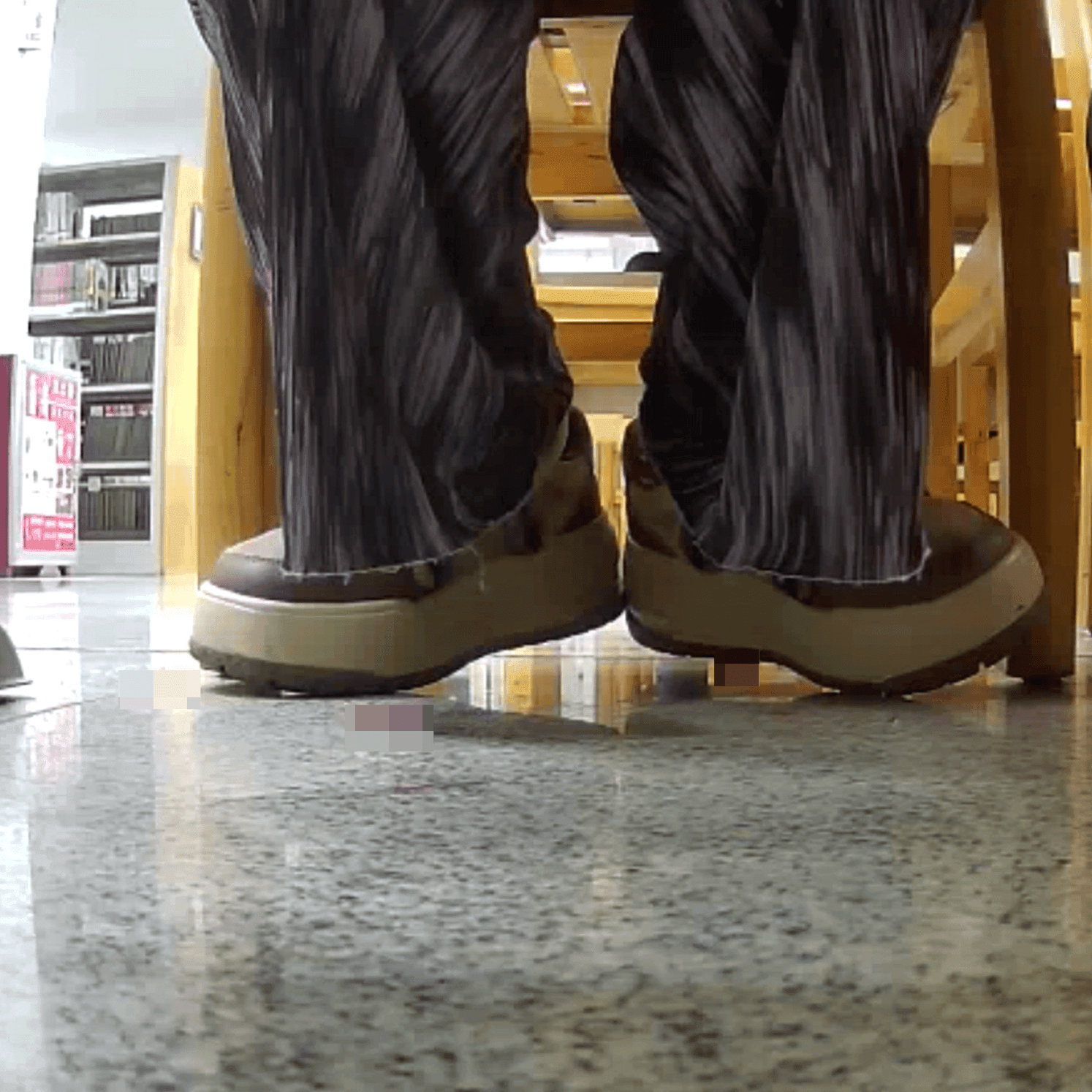 Woman at the library candid crush with the toe of her sneaker