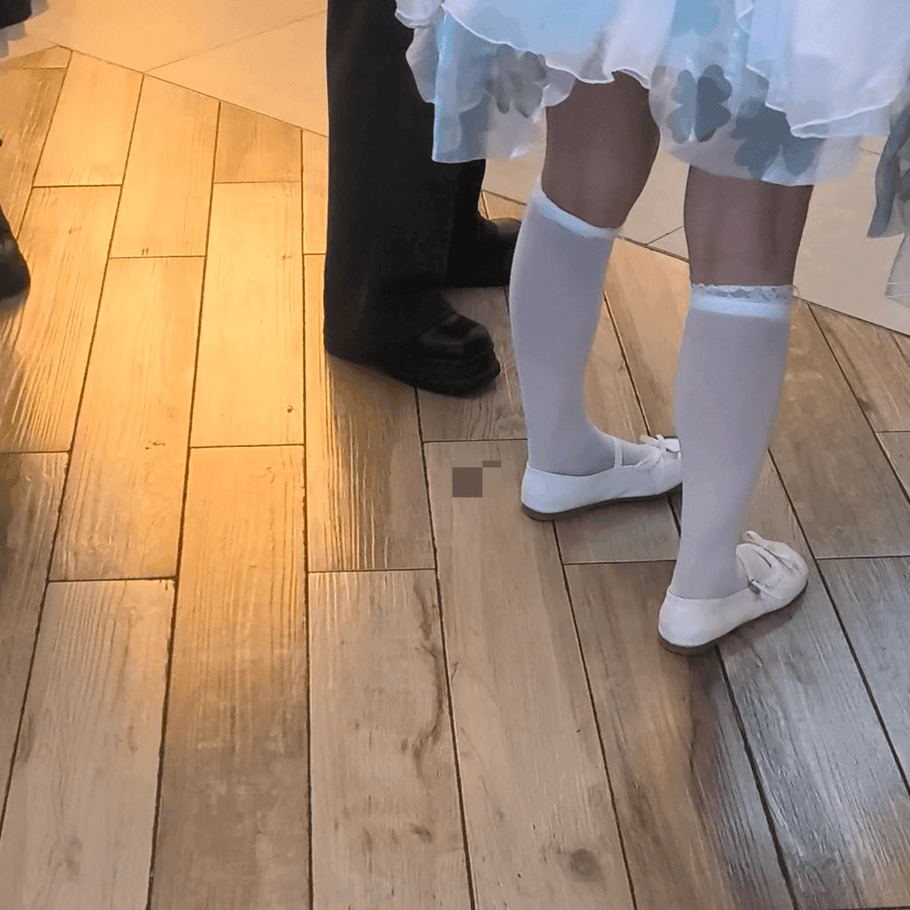 Anime convention cosplay woman in white stockings and leather shoes candid crush