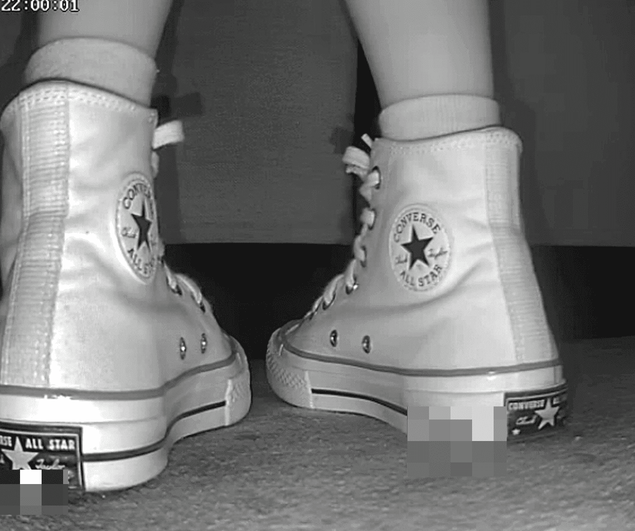 Woman candid crush with high-top white Converse at cinema