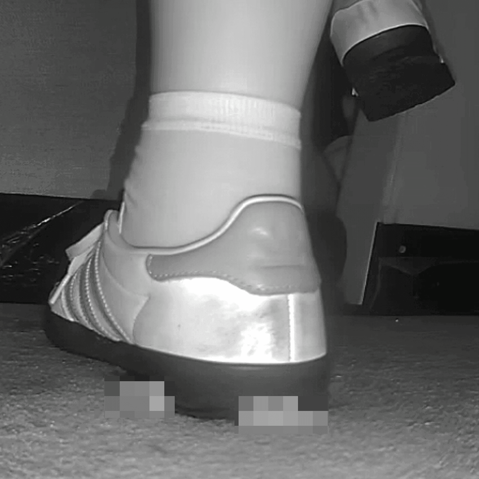 Woman in cinema candid crush with Adidas Samba sneakers