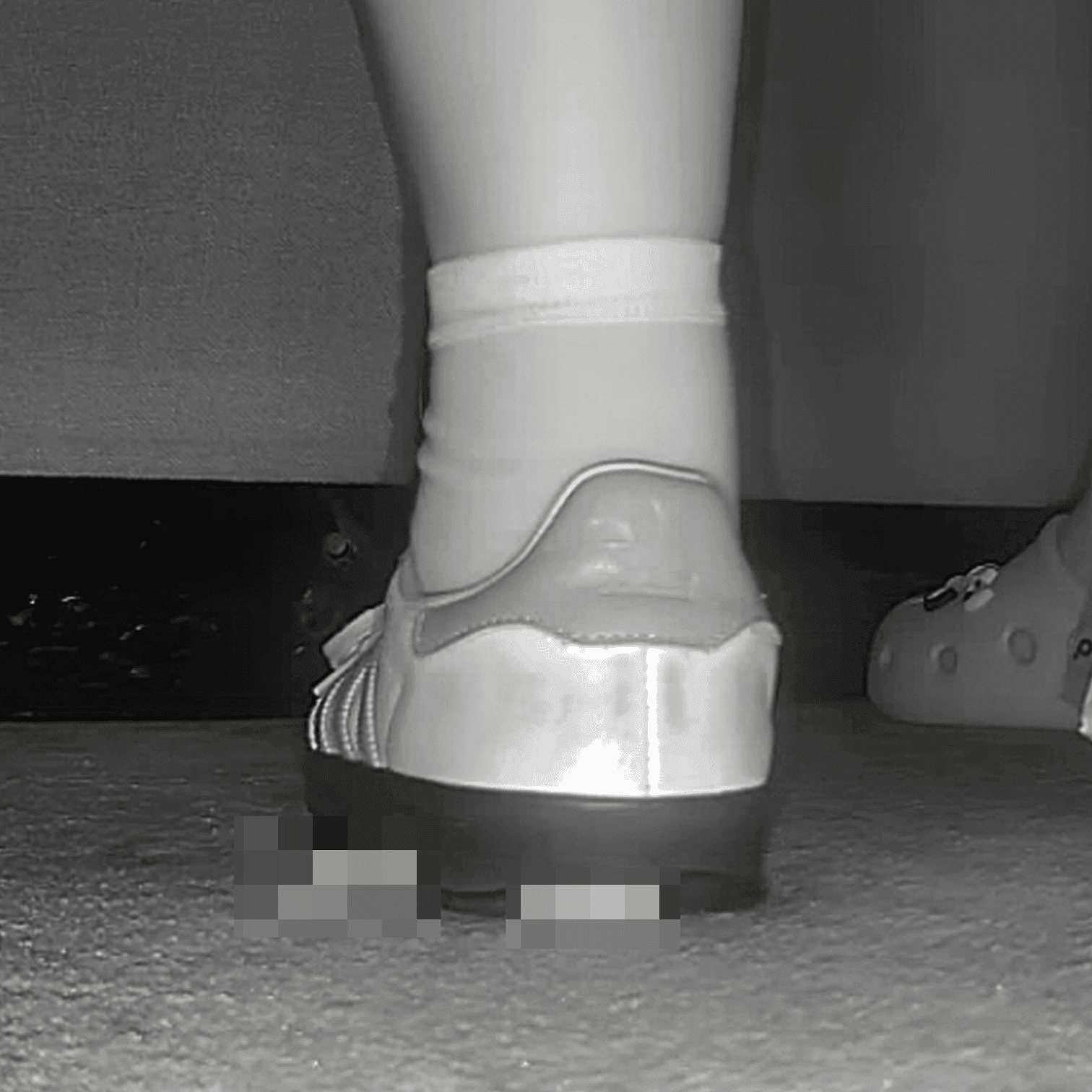 Woman in cinema candid crush with Adidas Samba sneakers
