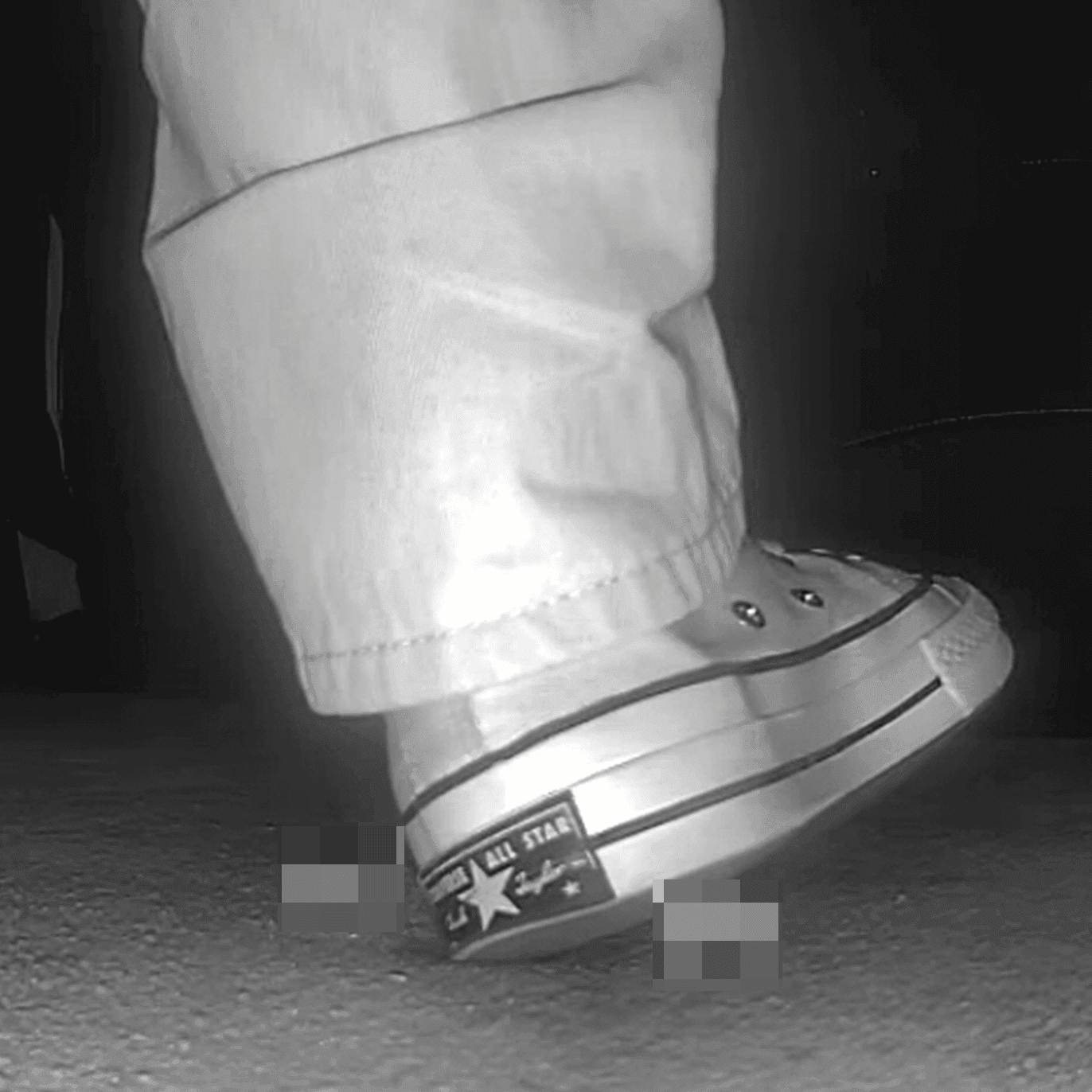 Woman in high-top Converse canvas shoes candid crush at the cinema