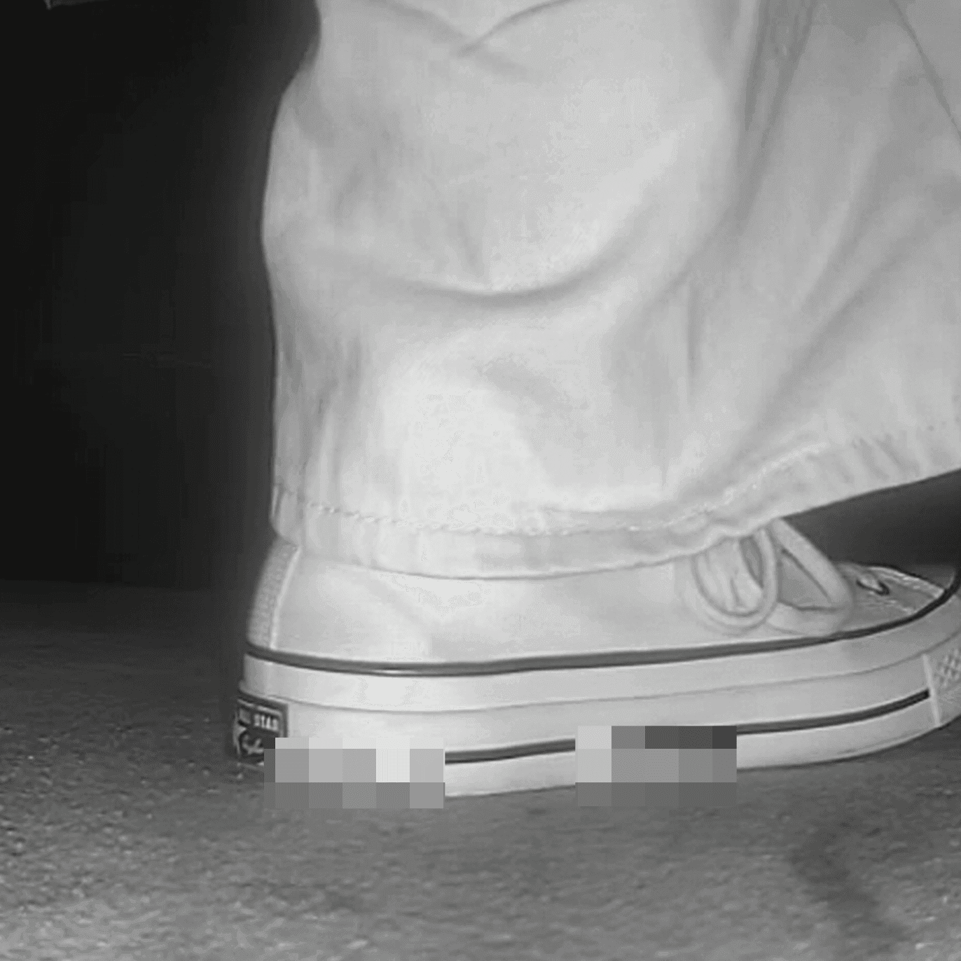 Woman in high-top Converse canvas shoes candid crush at the cinema