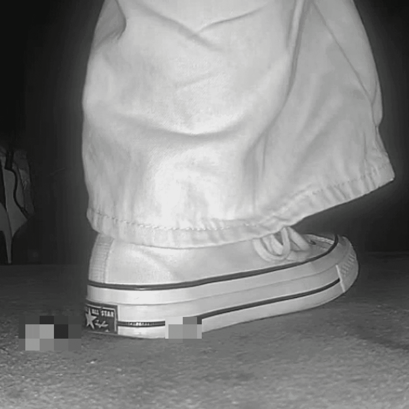 Woman in high-top Converse canvas shoes candid crush at the cinema