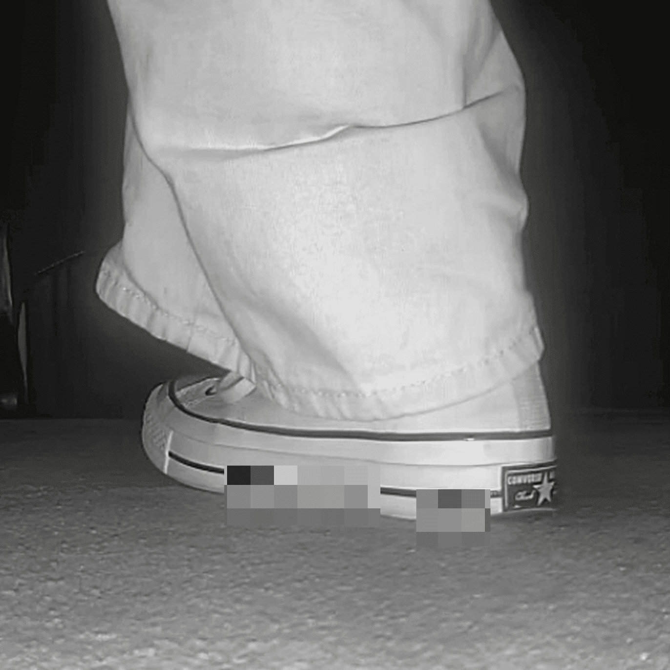 Woman in high-top Converse canvas shoes candid crush at the cinema