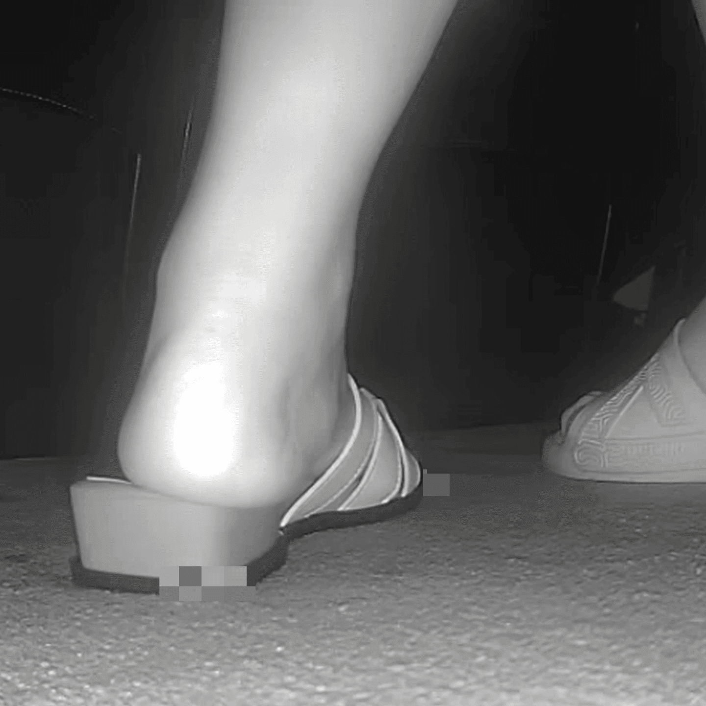 Woman candid crush with sandals in the cinema