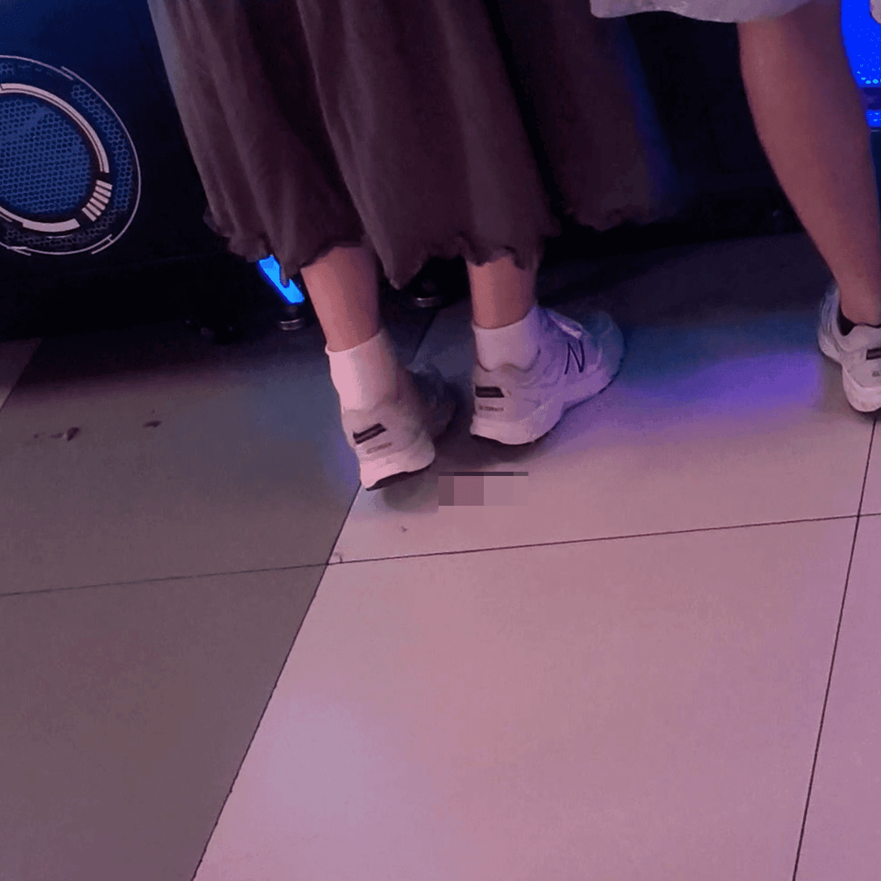 Game arcade woman candid crush with Converse shoes and stiletto heels while playing the basketball shooting machines