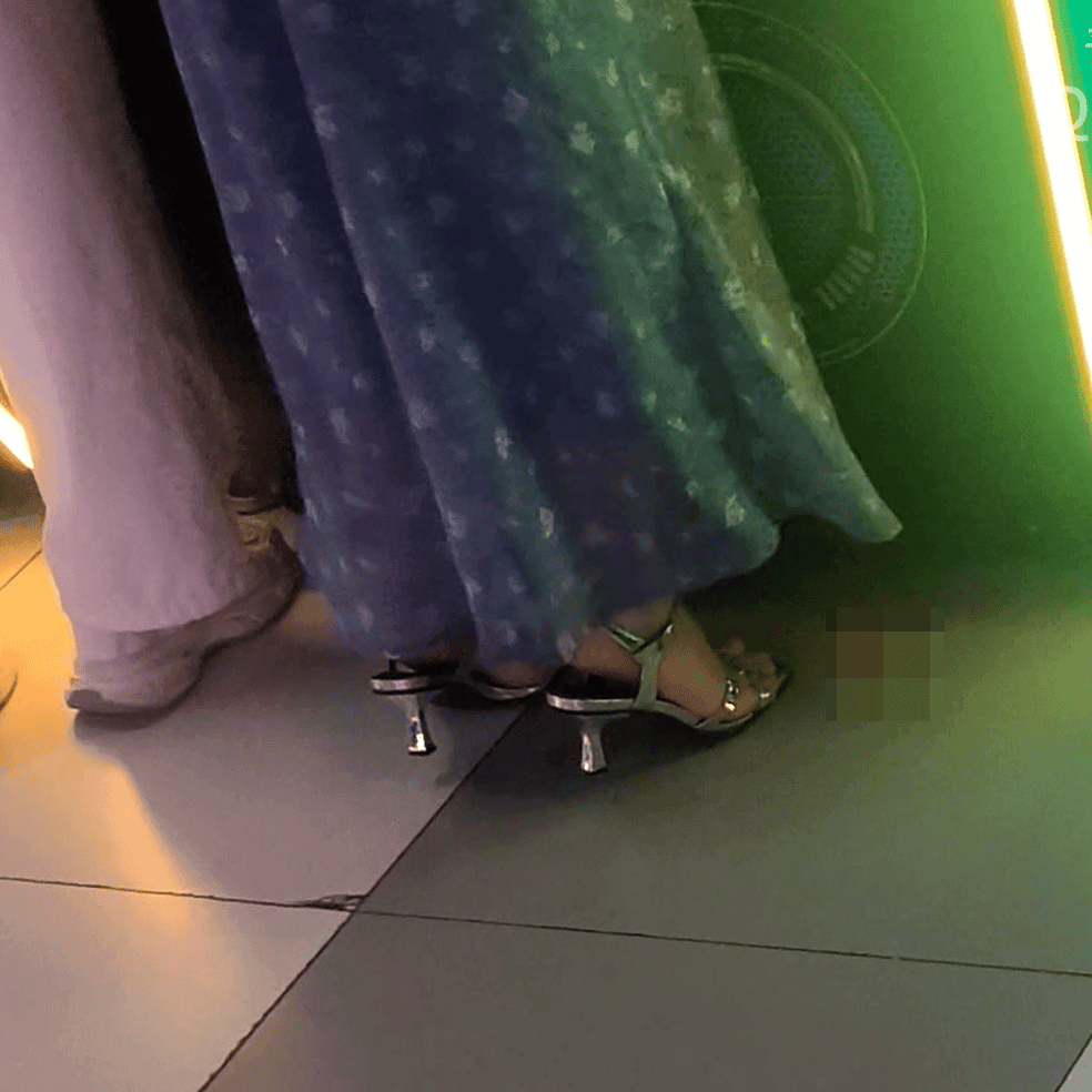 Game arcade woman candid crush with Converse shoes and stiletto heels while playing the basketball shooting machines