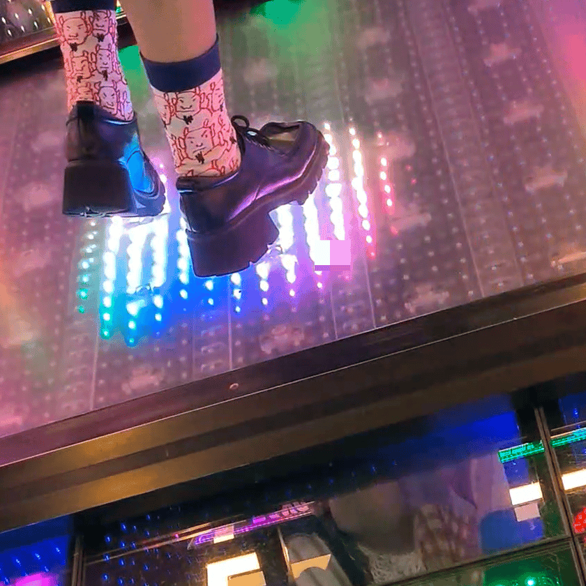 Dance machine woman candid crush with Adidas sneakers and long-sock leather shoes
